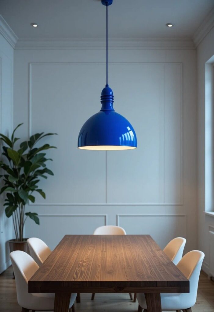 Colorful dining room with bold cobalt blue statement pendant light